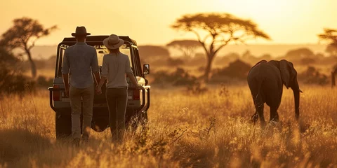 Foto op Canvas Couple exploring African grasslands during a safari expedition advanture © Brian