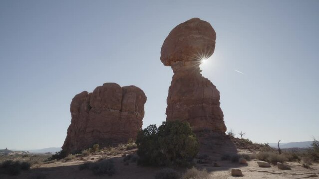 Sunbeams behind Balanced Rock in Arches National Park / Moab, Utah, United States