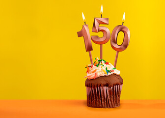 Candle with flame number 150 - Anniversary card on yellow background