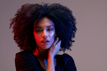 African young woman with afro hairstyle and glamour makeup. Beauty photo.