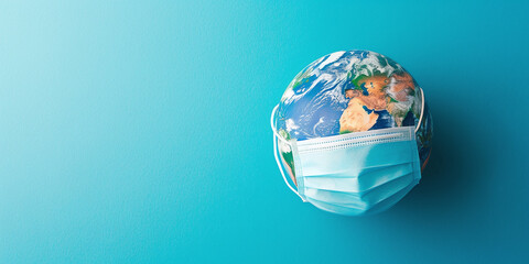 planet earth wearing a hospital mask on a blue background