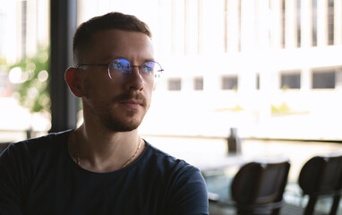 Portrait of a young guy in glasses