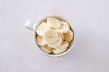 banana slices in a cup