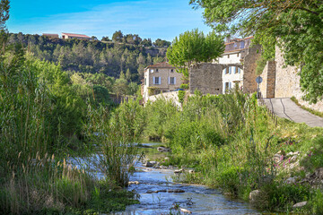 Fototapeta na wymiar An old Southern France village on the edge of a river