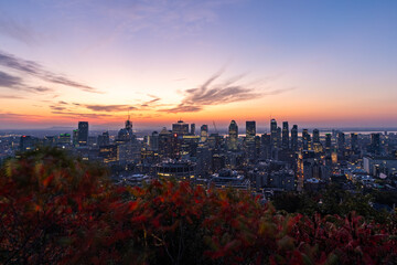 Montreal sunrise from Mont Royal Kondiaronk Belvedere with colorful leaves. Panoramic skyline view of downtown Montreal from top view at sunrise in Canada - obrazy, fototapety, plakaty