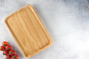 Square wooden board. Wooden utensils or plate for serving snacks. Top view. Copy space.