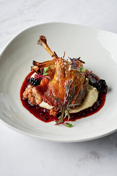 Roasted, confit duck leg, parsnip puree, spiced pork & fennel seed chipolata, roasted fennel bulb, duck jus, boysenberries