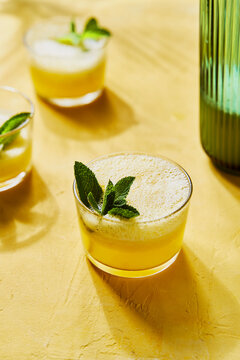 Pineapple Mint G&Ts with pourer on Yellow Background with Shadow