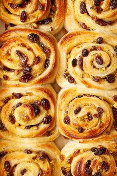 Sweet unglazed bread rolls filled with lemon curd, raisins and chopped pistachio nuts.