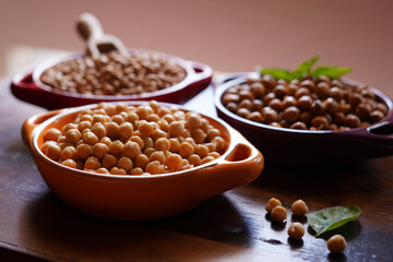 Trio of dried, cooked and roasted high fiber, protein rich legume, garbanzo beans commonly known as chickpeas.