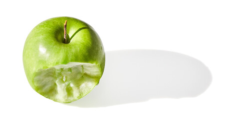 Bitten green apple on white background