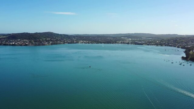 Wide aerial panorama over Lake Macquarie at Warners bay to Bolton point 4k.
