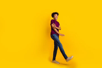 Fototapeta na wymiar Full length photo of cheerful funny good mood guy wear stylish violet clothes dancing cool party isolated on yellow color background