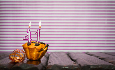 Birthday number 41. Date of birth with number of candles, copy space. Anniversary background with...