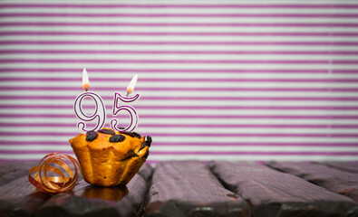 Birthday number 95. Date of birth with number of candles, copy space. Anniversary background with...