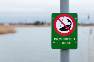 Fishing prohibited sign near lake - NO FISHING