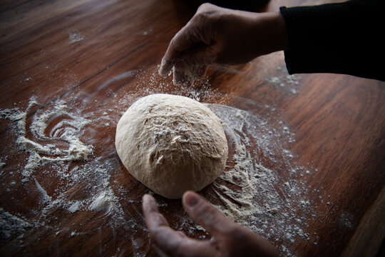 Chef hands making bread dough 