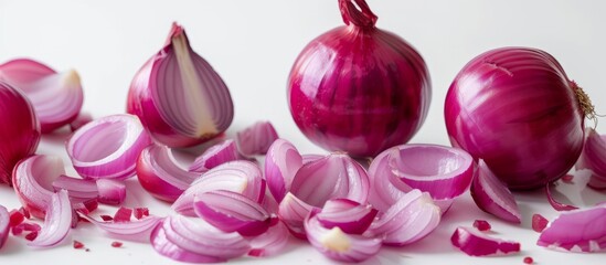 A stunning display of vibrant purple, pink, and magenta onions arranged like petals, resembling a creative arts masterpiece on a natural material table.