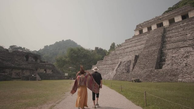 couple in Mayan ruins in Palenque, Chiapas, Mexico.
