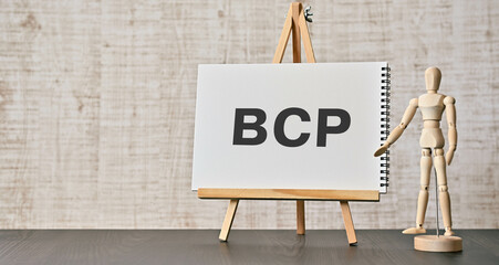 There is notebook with the word BCP. It is an abbreviation for Business Continuity Plan as eye-catching image. - obrazy, fototapety, plakaty