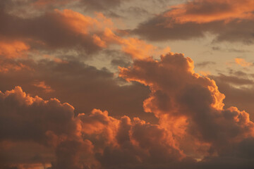 Orange Sunset background with different textures and colors in the clouds.