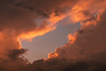 Orange Sunset background with different textures and colors in the clouds.
