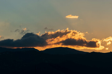 Orange Sunset background with different textures and colors in the clouds.