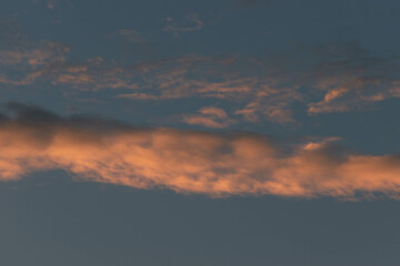 Orange Sunset background with different textures and colors in the clouds.