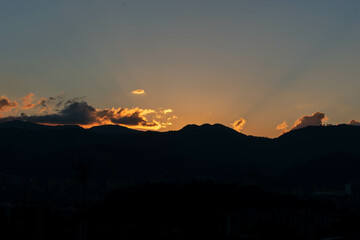 Orange Sunset background with different textures and colors in the clouds.