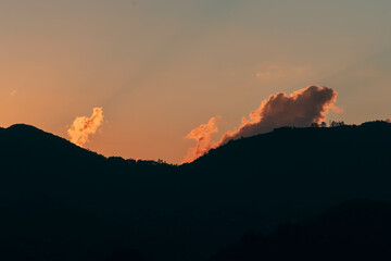 Orange Sunset background with different textures and colors in the clouds.