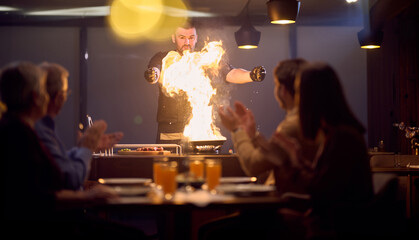 In a restaurant setting, a professional chef presents a sizzling steak cooked over an open flame,...