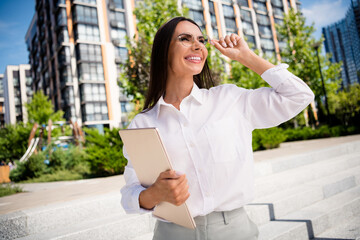 Photo of lovely cheerful latin lady dressed white stylish shirt eyeglasses looking sunny sky autumn warm days outside