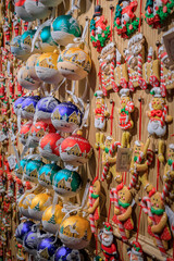 Display full of colorful Christmas ornaments and toys for sale at a souvenir shop in the old town in Strasbourg, France