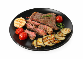 Delicious grilled beef steak with vegetables and spices isolated on white