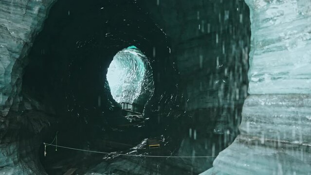 Static shot of the Katla Ice cave near Vik in southern Iceland. Water streaming down the icy walls.