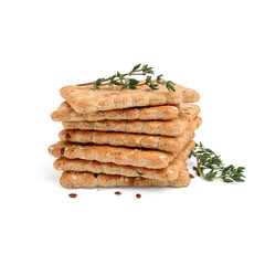 Stack of cereal crackers with flax, sesame seeds and thyme isolated on white
