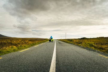 Rolgordijnen Atlantische weg Cyclist bicycle touring drive turn around on wild atlantic way road in Ireland. Travel adventure outdoors