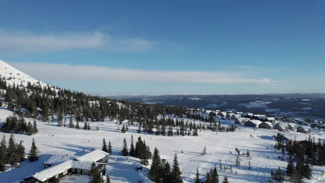 Aerial View of People Skiing in Trysil Norway Winter Sport Scandinavia - Panning Shot