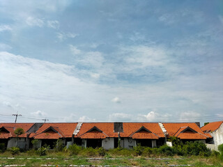 Closeup view of vintage old houses beside main street in Kendal, Indonesia.
