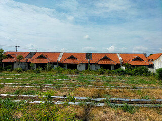 Closeup view of vintage old houses beside main street in Kendal, Indonesia.
