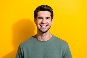 Portrait of toothy beaming positive guy with stubble brunet hair wear stylish t-shirt smiling...