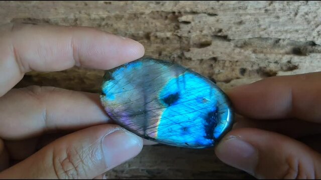 Labradorite oval shaped polished semi-precious gemstone  beautiful rainbow color fornt and back.