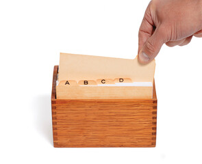 Selecting an Old File From a Vintage File Card Box