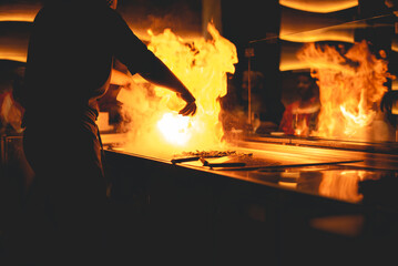Teppanyaki is a post-World War II style of Japanese cuisine that uses an iron griddle to cook food. 