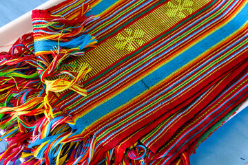 Close up view of colourful, traditional and cultural woven tais textile scarf in Timor-Leste,...