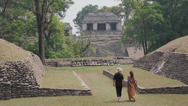 couple in Mayan ruins in Palenque, Chiapas, Mexico.