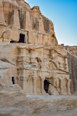 Fototapeta premium Entrance to a tomb carved into the rock in the Hegra archaeological park of the city of Petra, Wadi Musa, Jordan.