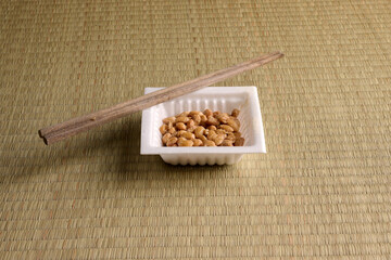 Japanese natto soybean in a styrofoam container with chopsticks