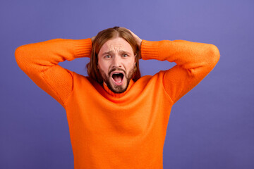 Photo of young funny man wear orange jumper stressed when boss tell him he is the worst team member...