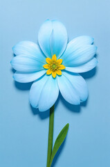 A single blue flower with a yellow center and green stem sits against a blue background. ai generative